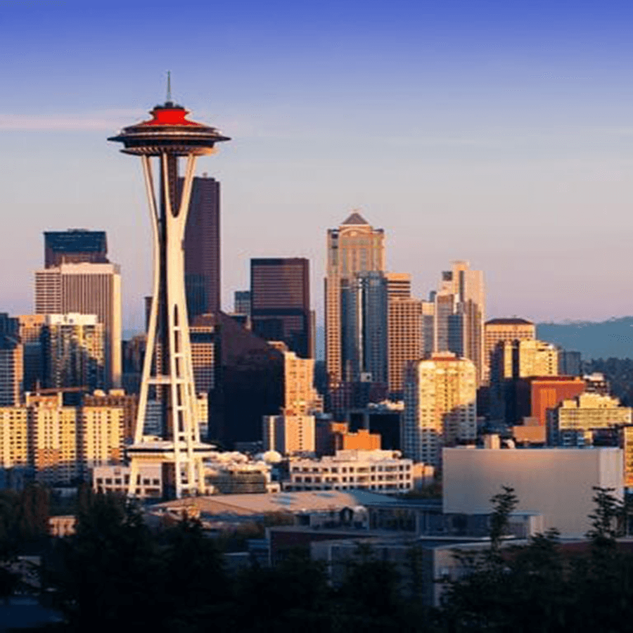 Seattle skyline featuring the Space Needle at sunset.