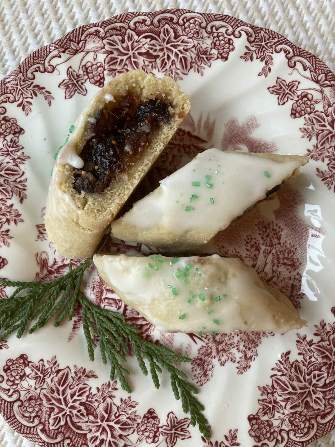 fig filled pastry on a red and white plate